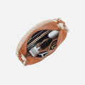Warm cashew-colored crescent-shaped hobo bag
