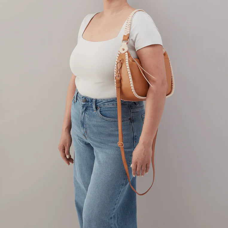 Warm cashew-colored crescent-shaped hobo bag